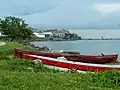Boats rest on the shore in Punta Gorda, Belize.
