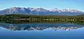 The Trident Range reflected in Pyramid Lake.Left to rightː The Whistlers, Indian Ridge, Muhigan Mountain.