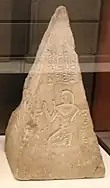 One face of the pyramidion depicting Kha kneeling in adoration of Ra