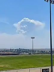 The fire producing a pyrocumulus cloud while burning in the Bradshaw Mountains