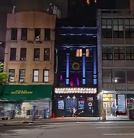 Facade of a four-story building at night