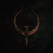 The rusted metal "Q" logo for the Quake video game series