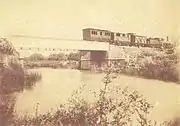 Old photograph of the railway bridge across the river near Boliqueime