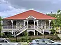 House, Ipswich, Queensland. Federation Filigree-style Queenslander with double access stairs.