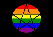 Rectangular flag with black background. A circumscribed pentagram (known as a pentacle) with black lines and a LGBTQ rainbow background sits in the center.