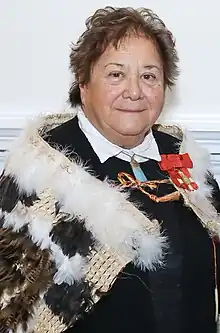 Rānui Ngārimu wearing a feathered cloak