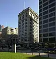 2009 photo of the R.H. Stearns Building taken from the Boston Common looking east across Tremont Street