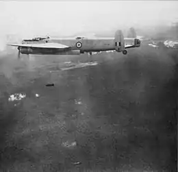 An Avro Lincoln bomber of No 1(B) Bomber squadron dropping 500-pound (230 kg) bombs on Communist targets during the Malayan Emergency