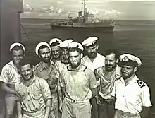 Image 4Australian sailors with a Bathurst-class corvette in the background. The RAN commissioned 56 of this class of corvettes during World War II. (from History of the Royal Australian Navy)