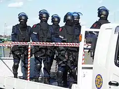 Anti-Firearms Squad of Japan armed with MP5 submachine guns, some are equipped with Brügger & Thomet Foldable Visor Helmet Stocks.