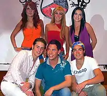 A group of teenagers smiling.