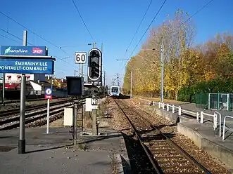 A train on the junction of slow and direct tracks