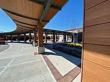 The renovated main entrance and security vestibule to Roslyn High School, along with the new canopy and plaza.