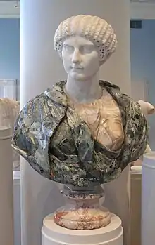 Museum bust with green verd antique drapery and an ancient Roman white Parian marble head of Agrippina Minor