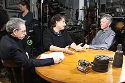 Robert Lawrence Kuhn, Peter Getzels and J. L. Schellenberg on the set of Closer To Truth