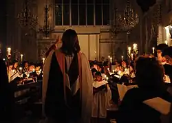 church choir singing by candlelight