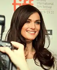 Smiling young woman with long dark hair