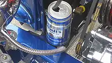a beer can with a hose going into it