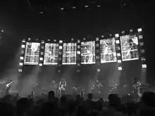 Radiohead performing on stage behind a bank of monitors