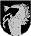 A coat of arms depicting a silver horse that is rearing and neighing all on a dark green background bordered by a thin silver line