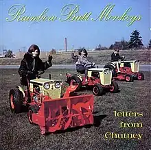 An image of three ladies riding tractors. The band's name is written cursively above and the album's title is on the lower right corner, both colored yellow.