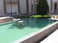 The courtyard and the pool in Rakib-khaaneh mansion in Isfahan, Iran