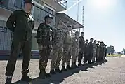 Military personnel from participating countries in the "Rapid Trident-2014" exercise assembling in front of the command post of the training center, on September 19, 2014.