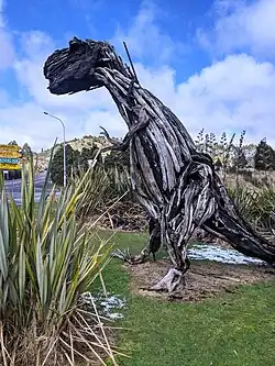 T-rex sculpture made of driftwood