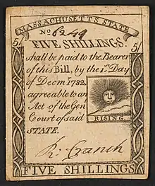 A 1779 five-shilling note issued by Massachusetts with the inscription:  "FIVE SHILLINGS. shall be paid to the Bearer of this Bill, by the 1st Day of Decmr. 1782 agreeable to an Act of the Genl, Court of said STATE."; Within print of sun: "RISING".
