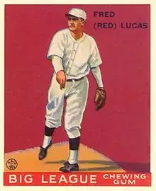 A baseball card of a man in a white baseball uniform having just thrown a ball.