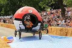 A participant to the race held in Alexandra Palace, London (2017) driving through the course on a Pokémon-inspired soapbox: creativity plays a huge role in the competition, as the style of every single vehicle is inspired by folklore, pop culture or everyday-life themes.