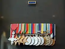 Colour photo of a group of military medals mounted on a black background