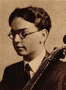 Sepia image of left profile of Gábor Rejtő holding cello