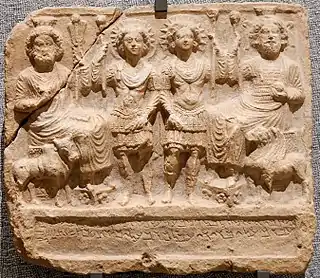 Bas-relief of four human-looking gods