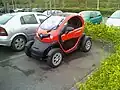 Renault Twizy compared to a regular-sized car.