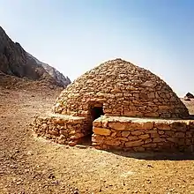 One of a small cluster of Hafit-period beehive tombs at the Mezyad – Jebel Hafeet Desert Park near Al Ain City in the Eastern Region of Abu Dhabi, which have been restored to show their original construction
