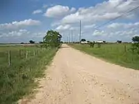 A few homes remain near the former site of Rexville. The view is northeast on Rexville Rd near Mieth Rd.