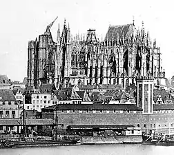 The unfinished cathedral in 1856. The east end had been finished and roofed, while other parts of the building are in various stages of construction.