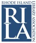 Logo for RILA featuring the large letters R I L A in blue with the words  Rhode Island Library Association around it at a right angle