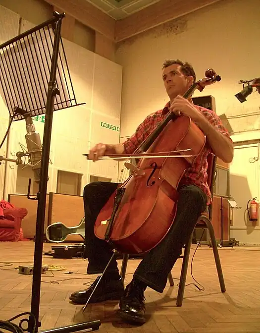 A photograph of Richard Dodd playing a cello.
