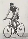 A male cyclist riding his bicycle