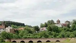 View of Rieneck with church, castle and bridge over the Sinn river