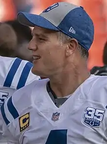 Adam Vinatieri wearing an Indianapolis Colts jersey and hat.