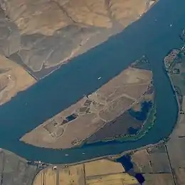 An aerial photo of islands with farms on them.