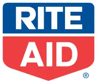 The words "Rite" and "Aid" written in white, all-capitals text, inside of a pentagon. The top half of the pentagon, containing the word "Rite", is blue, while the bottom half, containing the word "Aid", is red.