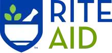 The logo for Rite Aid, featuring the word "Rite" in blue above, "Aid" in green underneath, and both words in all capital letters. To the left of the words is a stylized depiction of a mortar and pestle.
