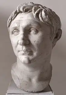 Marble portrait bust of a young man with short hair.
