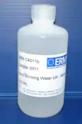 A natural river water certified reference material in its polythene bottle after production
