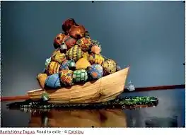 Wood boat, bundles made with African fabrics, glass bottles, 2016