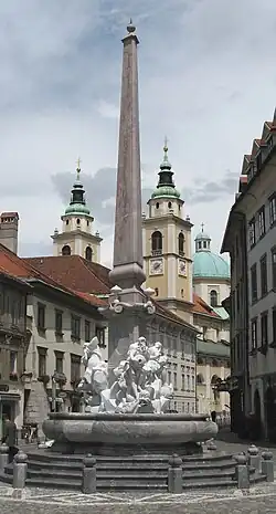 Replica of the Robba Fountain at Town Square, Ljubljana. The sculptural part of the fountain is made of Carrara marble, the obelisk of local Lesno Brdo limestone, and the pool of local Podpeč limestone.